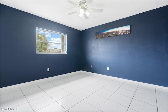 unfurnished room with light tile patterned floors and ceiling fan