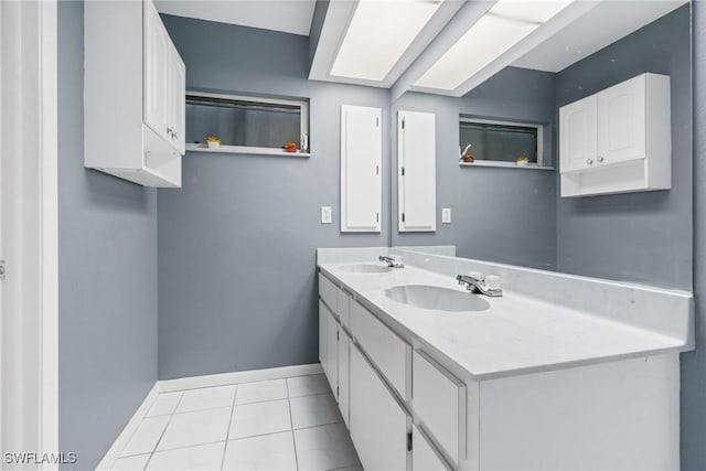 bathroom featuring tile patterned flooring and vanity