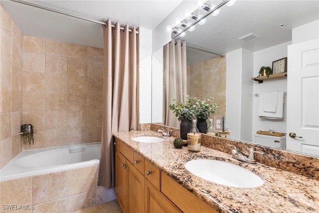 bathroom with vanity, tile patterned floors, and shower / bath combo with shower curtain