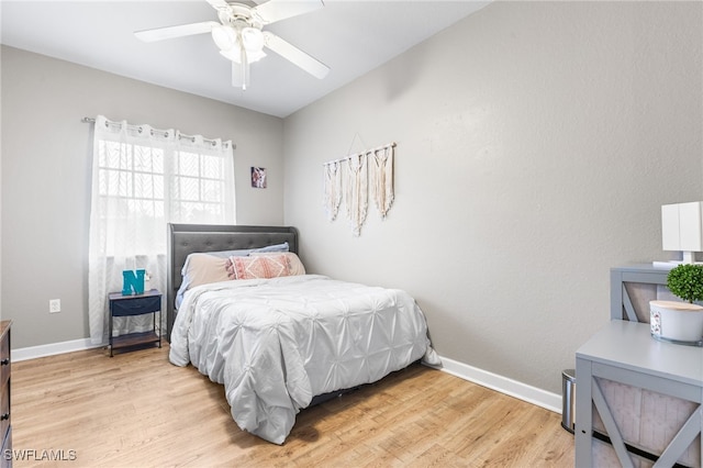 bedroom featuring ceiling fan and light hardwood / wood-style flooring