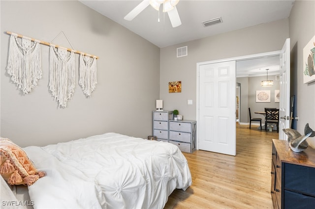 bedroom with hardwood / wood-style flooring and ceiling fan