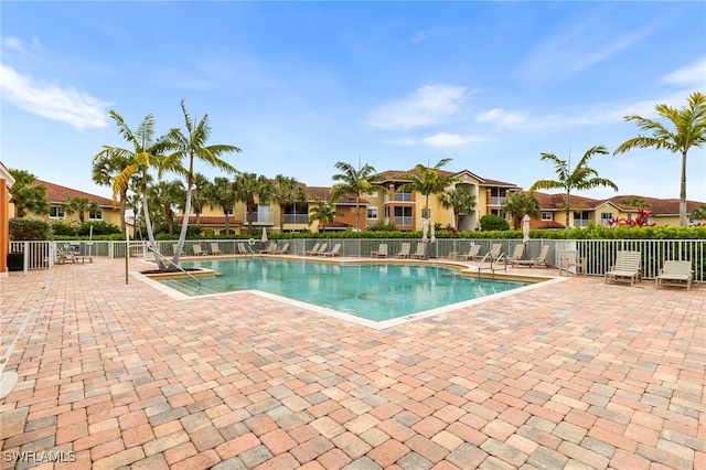 view of swimming pool featuring a patio area