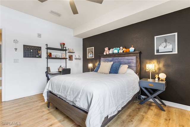 bedroom featuring wood-type flooring and ceiling fan