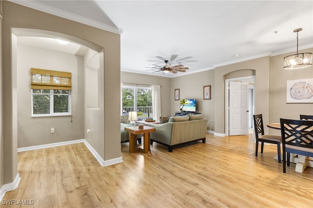 living room with crown molding and light hardwood / wood-style flooring