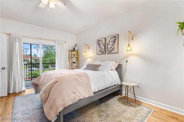 bedroom featuring ceiling fan, access to exterior, and hardwood / wood-style floors