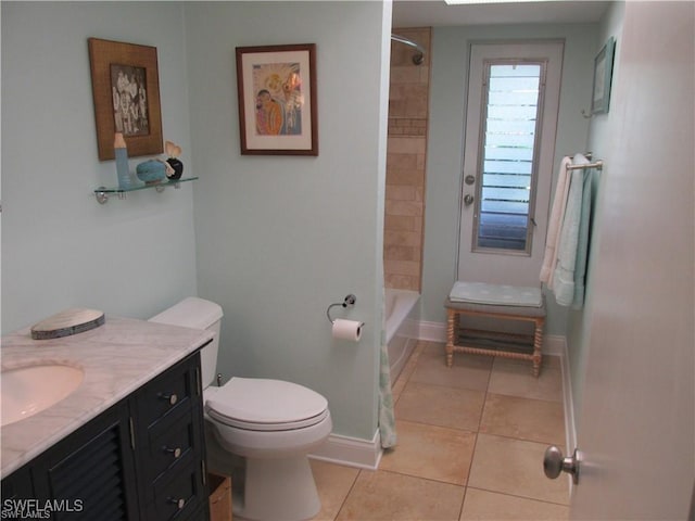 full bathroom featuring tiled shower / bath combo, toilet, tile patterned flooring, and vanity