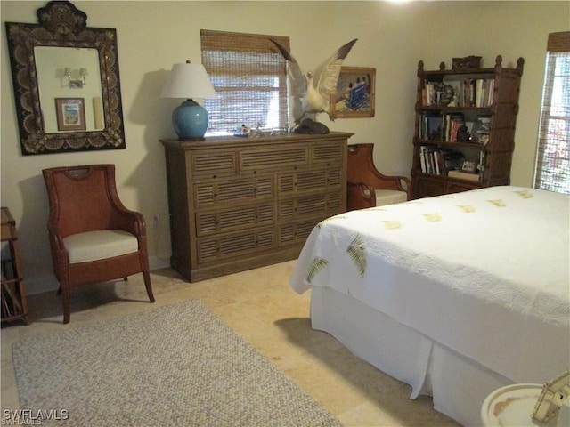 bedroom featuring multiple windows