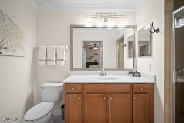 bathroom featuring crown molding, vanity, toilet, and a shower with shower door