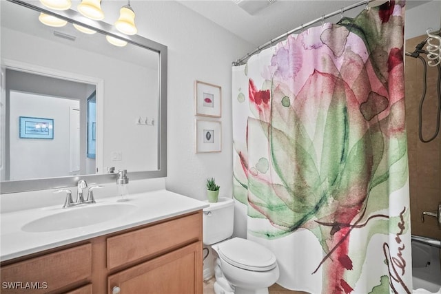 full bathroom featuring vanity, shower / tub combo, and toilet