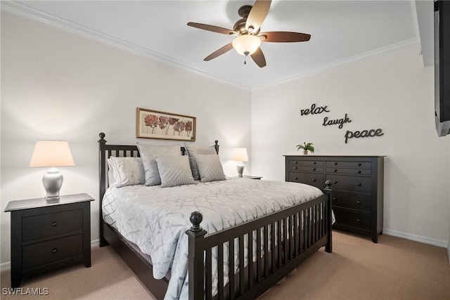 carpeted bedroom with ceiling fan and ornamental molding