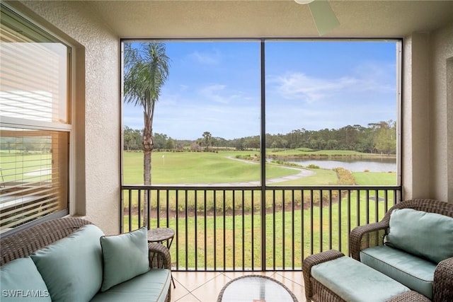 sunroom featuring a water view and a healthy amount of sunlight