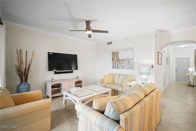 tiled living room with crown molding and ceiling fan