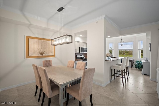 dining area with light tile patterned floors and crown molding