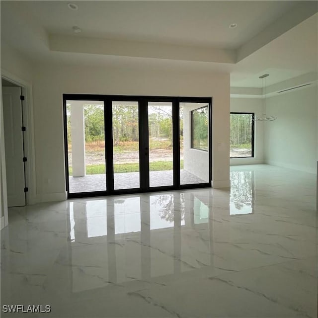 interior space featuring a raised ceiling