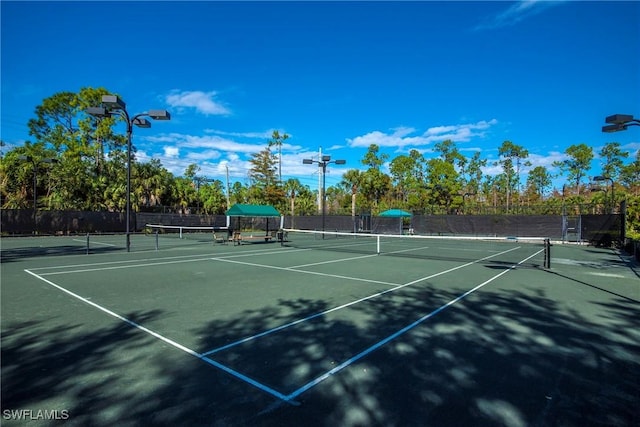 view of sport court with fence