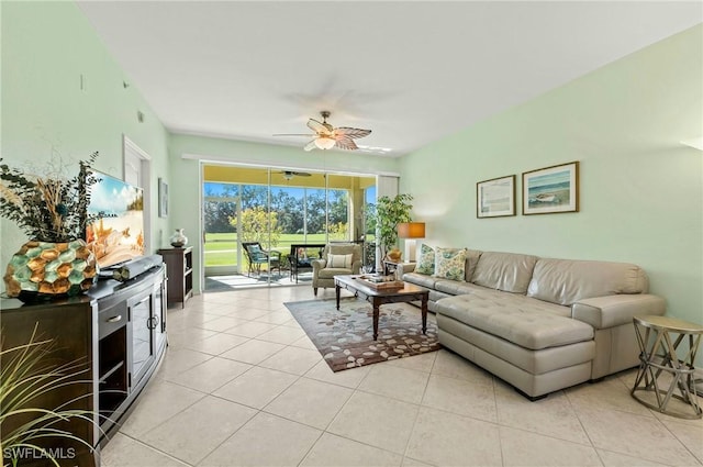 living room featuring light tile patterned floors and ceiling fan