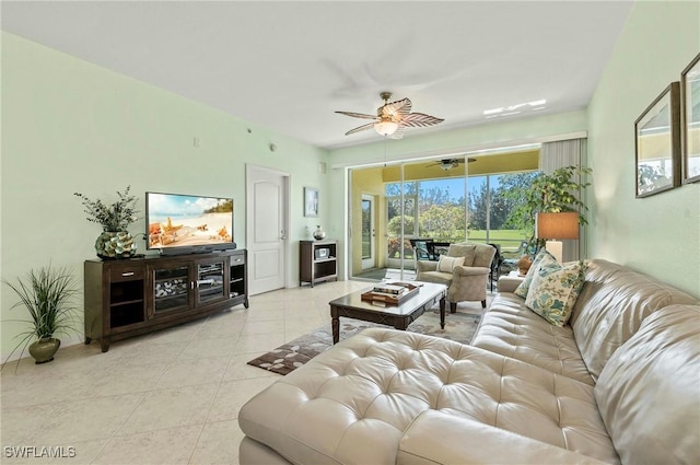 tiled living area with a ceiling fan