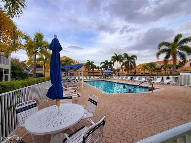 pool featuring a patio and fence