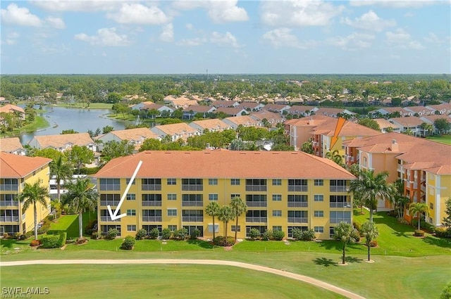 aerial view featuring a residential view, a water view, and view of golf course