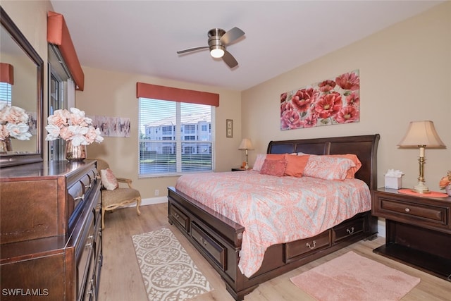 bedroom featuring light hardwood / wood-style flooring and ceiling fan