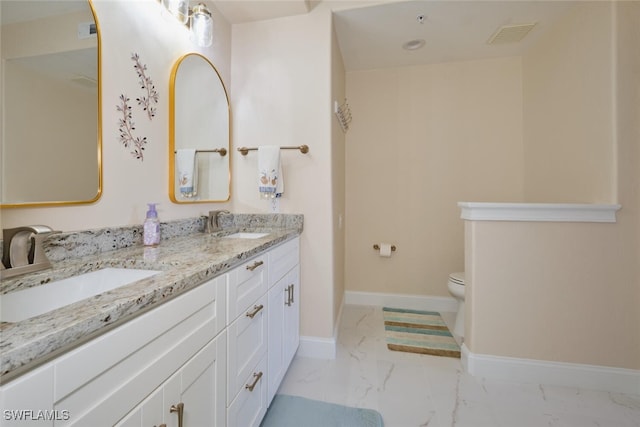 bathroom with toilet and vanity