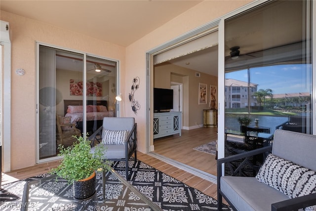 exterior space featuring ceiling fan