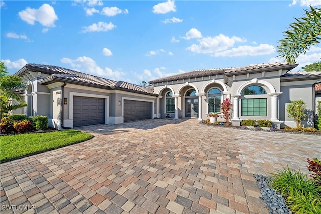 mediterranean / spanish house featuring a garage