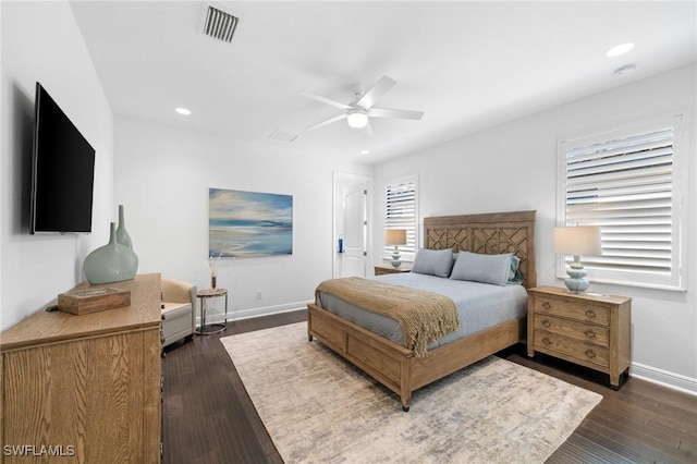 bedroom featuring dark hardwood / wood-style flooring and ceiling fan