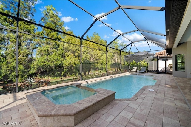 view of swimming pool featuring an in ground hot tub, a lanai, and a patio