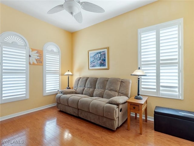 living room with hardwood / wood-style floors and ceiling fan