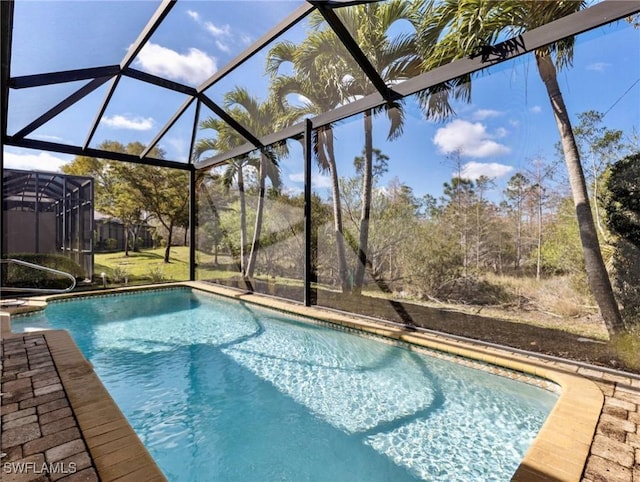 view of pool with a lanai