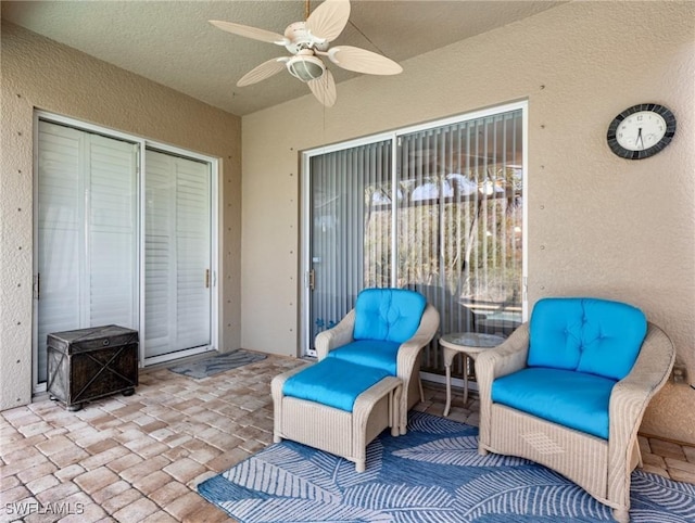 view of patio / terrace featuring ceiling fan