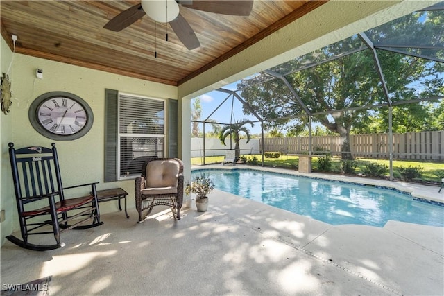 view of pool with a patio, a lanai, and ceiling fan