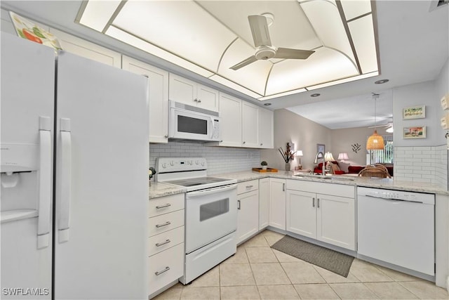 kitchen with light tile patterned flooring, sink, white cabinetry, ceiling fan, and white appliances