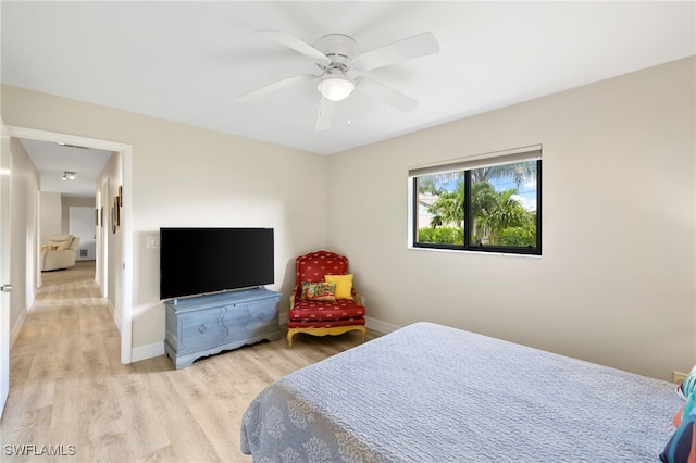 bedroom featuring light wood-type flooring and ceiling fan