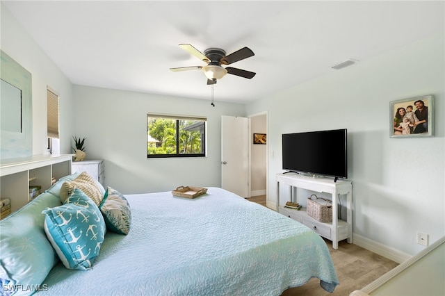 bedroom with light hardwood / wood-style floors and ceiling fan