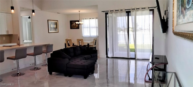 living room featuring a notable chandelier