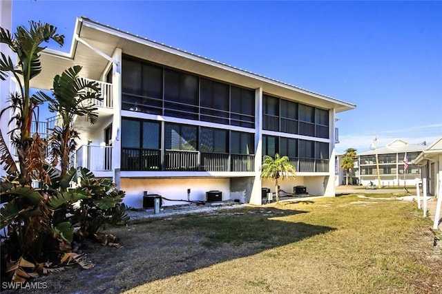 view of property exterior featuring a yard and cooling unit