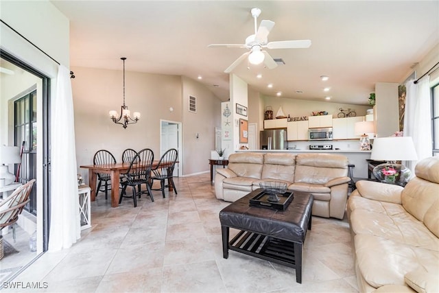 living room with ceiling fan with notable chandelier, vaulted ceiling, and light tile patterned flooring