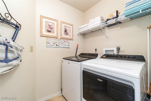 washroom featuring washer and dryer