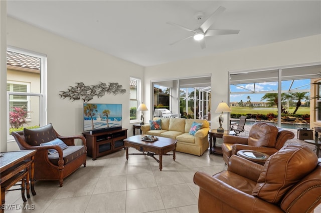 living room with light tile patterned floors and ceiling fan