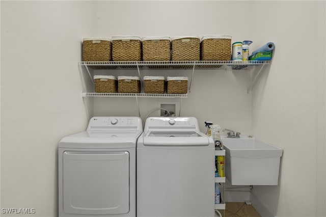 laundry area with sink and washer and dryer