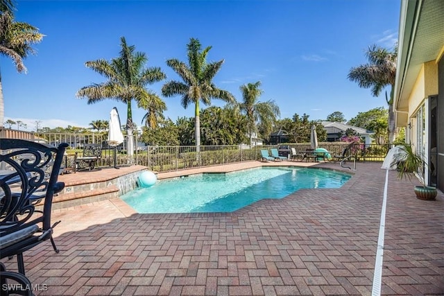 view of swimming pool featuring a patio