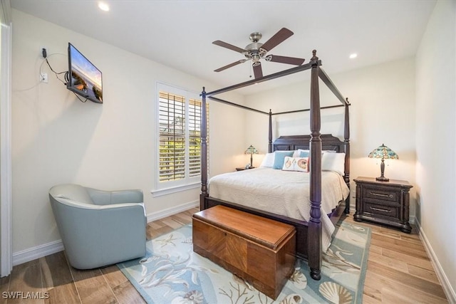 bedroom with ceiling fan and light wood-type flooring