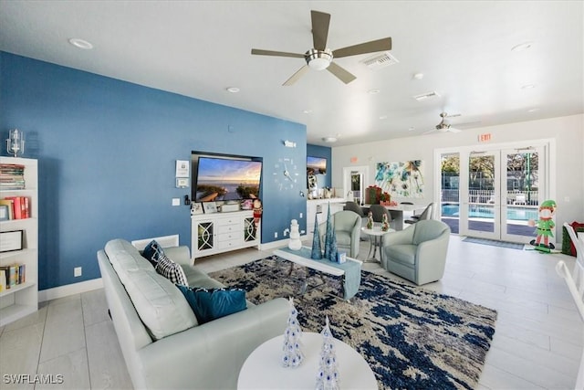 living room featuring french doors and ceiling fan