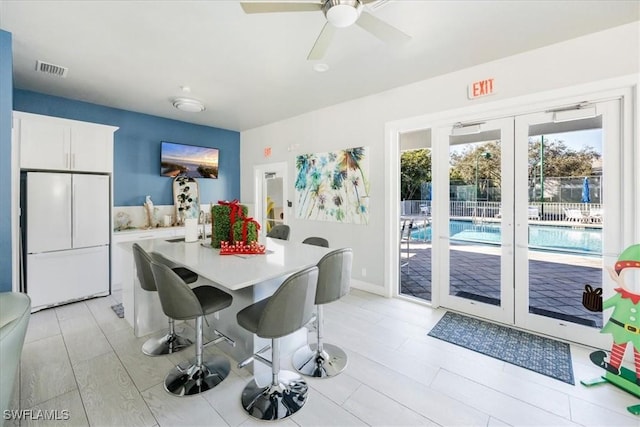 dining room featuring ceiling fan