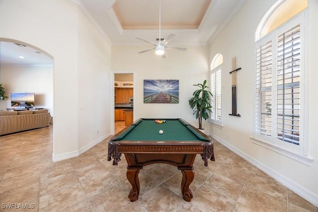 game room featuring billiards, tile patterned flooring, ornamental molding, ceiling fan, and a tray ceiling