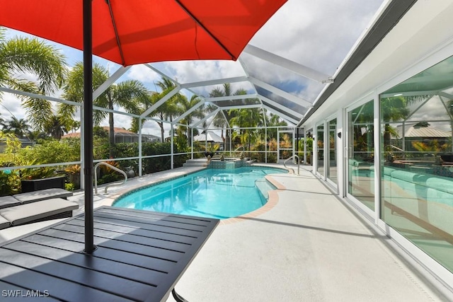 view of pool with glass enclosure and a patio