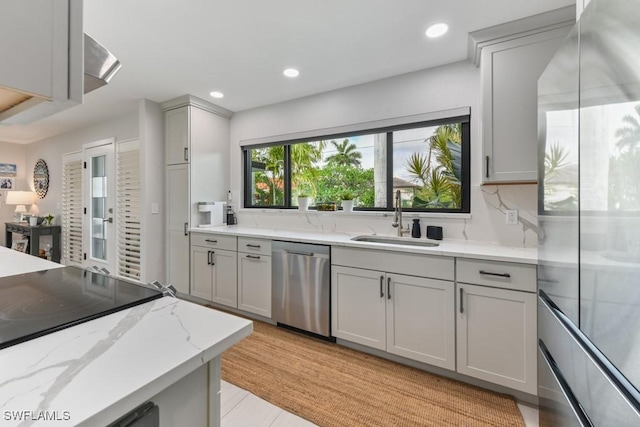 kitchen with dishwasher, sink, backsplash, light stone counters, and gray cabinets