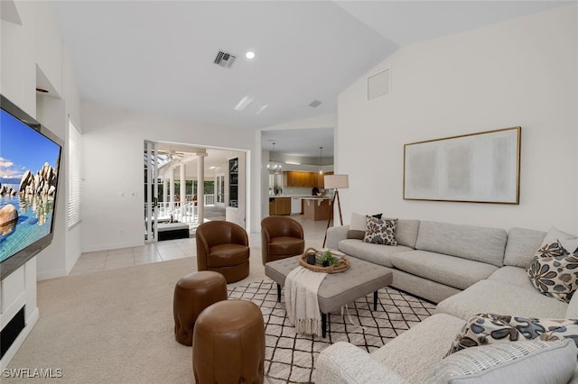 living room featuring light colored carpet and lofted ceiling